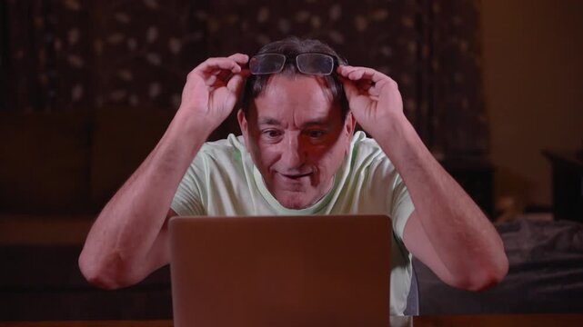 Happy man using a laptop gives thumbs up as a glowing rainbow appears behind him, symbolizing inspiration, breakthrough ideas, success, and positive thinking. 15132