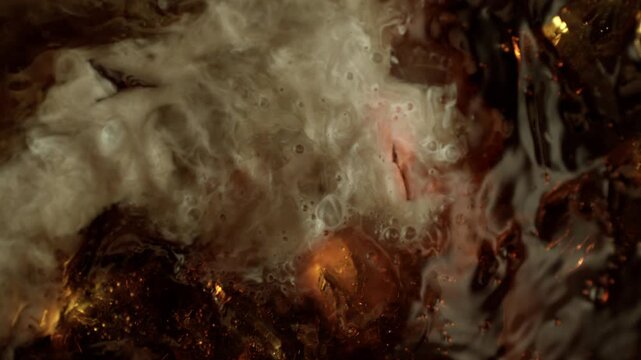Super Slow Motion Shot of Swirling Cream Mixing in Coffee with Ice Cubes at 1000fps.