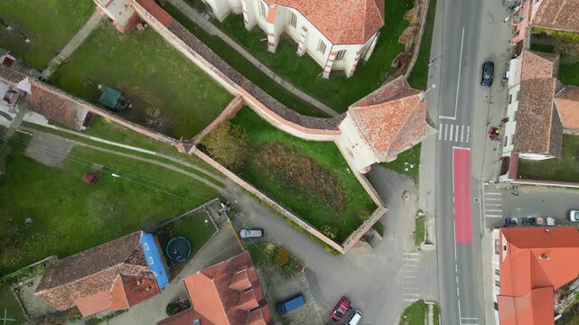 High angle view of the restored Rupea medieval citadel built on a basalt rock in Brasov, Transylvania. Spectacular historic Saxon fortress in a scenic Romanian rural landscape.