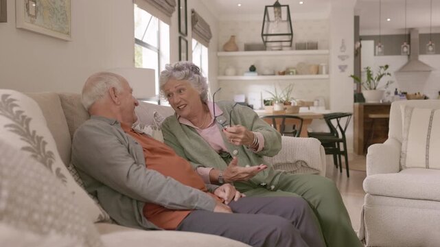 Retired couple talking together with joy