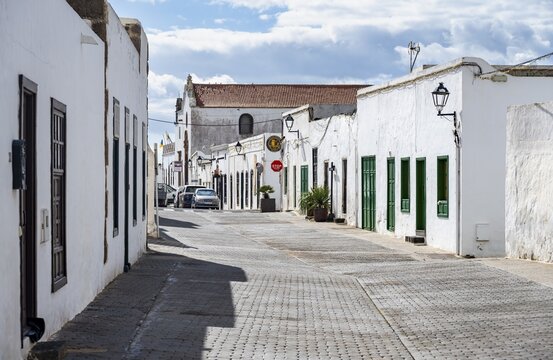 Typical white houses with colored doors and windows in an alley, Teguise, Lanzarote, Canary Islands, Spain