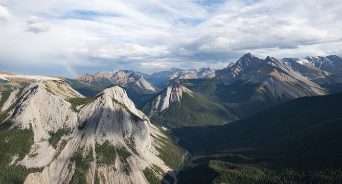 Mountain landscape with river valley and peaks, rainbow, peaks with orange sulphur deposits, Overturn Mountain, panoramic view, Nikassin Range, near Miette Hotsprings, Sulphur Skyline, Jasper National Park, Alberta, Canada