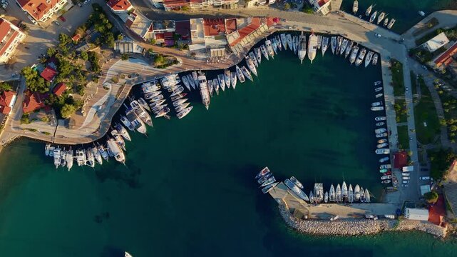 Aerial view of yachts and boats moored along coastal marina of Datcha Turkey.