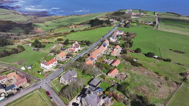 Aerial video Ravenscar UK. Ravenscar is a coastal village in the county of North Yorkshire, England. It is within the civil parish of Staintondale and the North York Moors National Park.