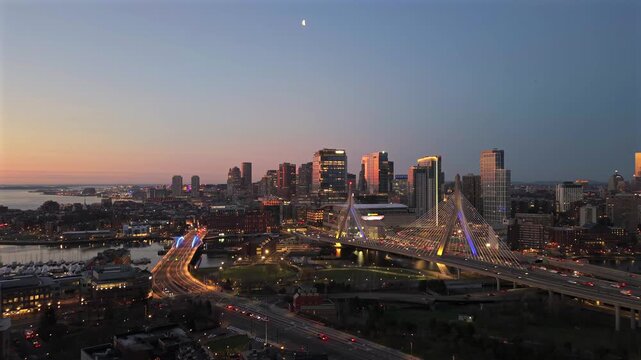 Dawn drone view of Boston skyline and Zakim Bridge traffic