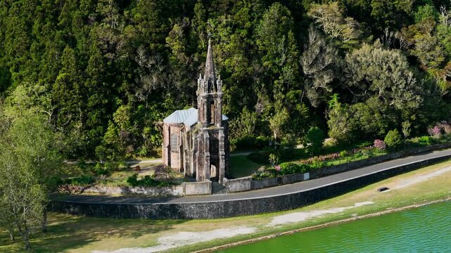 Drone shot of Capela de Nossa Senhora das Vitorias church on Furnas Lake in Furnas, Sao Miguel, Azores, Portugal