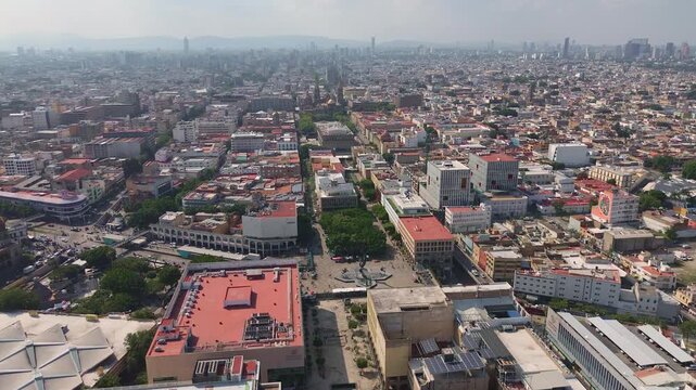 Guadalajara, Jalisco Mexico; October 10 2025. Plaza Tapatia and Calzada Independencia intersection are captured in an aerial drone push in showing city traffic and the Cathedral background.