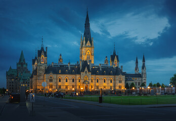 Naklejka premium West Block of the Canadian Parliament Illuminated at night on Parliament Hill - Ottawa, Ontario, Canada