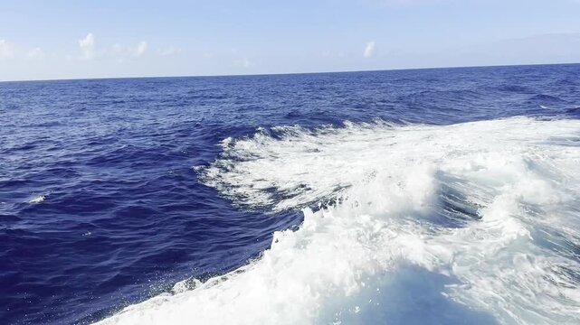 ship proceeding at ocean, fare off shore. breaker wave came opposite the swell, overturn. make foam and drops. nonstop video. background. 
