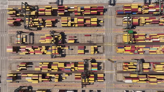 Cargo containers stacked in port yard highlight global supply chain challenges and shipping congestion
