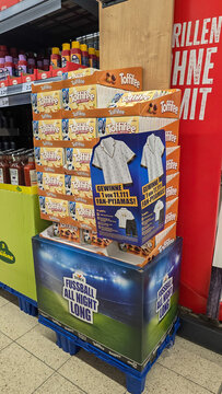 Nussdorf, Germany - May 15, 2026. Football-themed marketing stand with the slogan Fussball All Night Long with Toffifee candies. Raffle for themed pajamas.