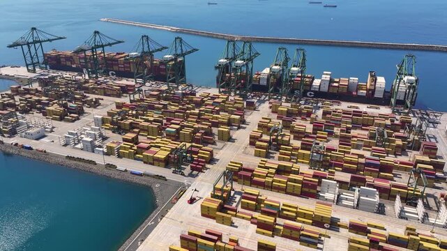 Cargo containers sit idle at ports as global supply chain delays impact international trade in shipping industry