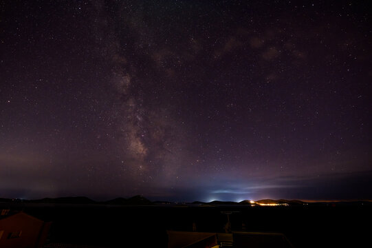 Milky Way galactic core glows over Adriatic islands of Pakostane Croatia night sky