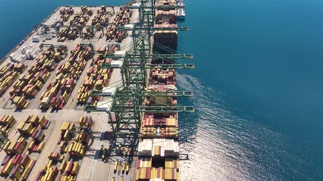 Container terminal operations show impacts of shipping congestion on global supply chain and freight transportation logistics
