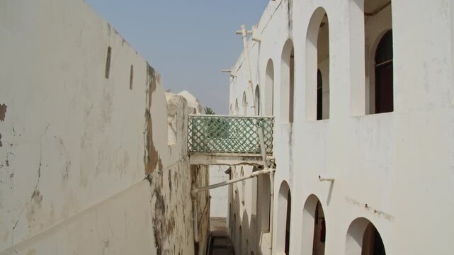 Cinematic pan inside historic white walls of Jamestown Lighthouse in Accra Ghana a key landmark for West African heritage, tourism and colonial history within Africa