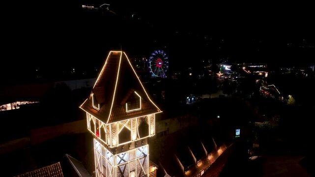 Night View Of Capivari Village In Campos Do Jordao In Sao Paulo Brazil. Illuminated Ferris Wheel. Downtown Cityscape. European Architecture. Capivari Village In Campos Do Jordao In Sao Paulo Brazil. 