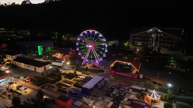 Night View Of Capivari Village In Campos Do Jordao In Sao Paulo Brazil. Illuminated Ferris Wheel. Downtown Cityscape. European Architecture. Capivari Village In Campos Do Jordao In Sao Paulo Brazil. 