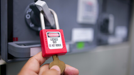 LOTO safety lock, red danger padlock, equipment lockout, maintenance protection, energy isolation device © supakitmod