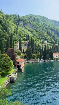 Beautiful Scenic View of Lake Como Coastline with Cypress Trees and Villas