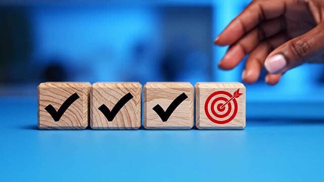 Strategic hand placing target goal block next to completed task checkmarks, symbolizing business success, objective achievement, project management, efficiency, and growth. Concept of smart planning.