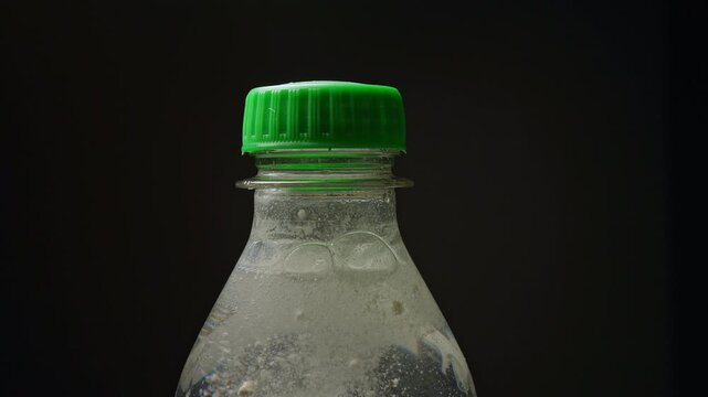 Suspicious looking pop drink, spiking drink. Educational concept of drink spiking. Depiction of drugged drink with white powder, illegal activity at bar, party or in the club.