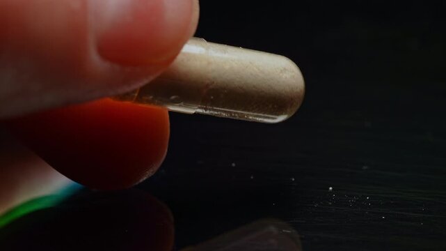Concept of Synthetic opioid drug of fentanyl in the capsule for distribution. Educational concept of Mental health youth overdose in Indigenous communities. Drug opioid crisis and struggle addiction