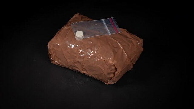 Illegal drugs seized from cartel narcotics smuggled border concept. Powder heroin and methamphetamines package. Educational concept of black market trade narcotics distribution and criminal activity