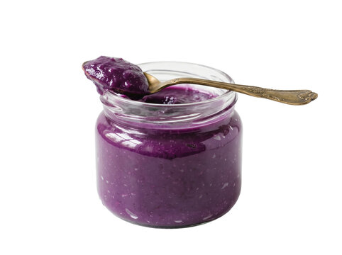 Glass Jar of Ube Halaya Purple Yam Jam with Vintage Brass Spoon Isolated on White Background &ndash; Filipino Dessert Spread in Ethnic Packaging Style
