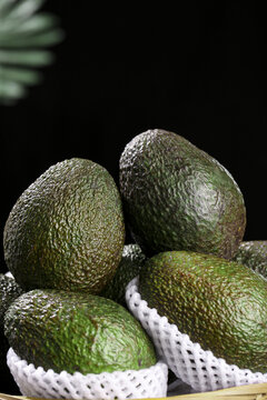 Fresh Whole Avocados in White Mesh Containers Studio Still Life Photography