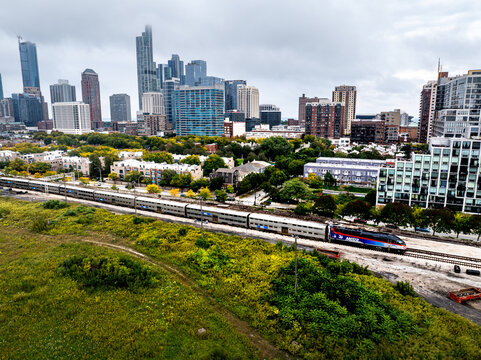  Aerial View of Metra Passenger Train Running Along Chicago&rsquo;s Near West Side With Downtown Skyline in Background