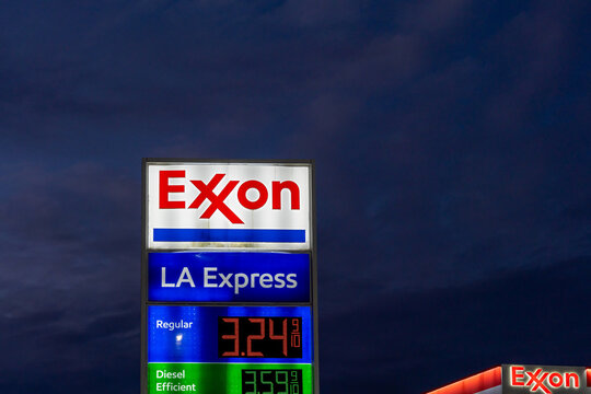 
New Orleans, Louisiana, USA - February 12, 2022: A signage for Exxon gas stations at night. New Orleans, Louisiana, USA
