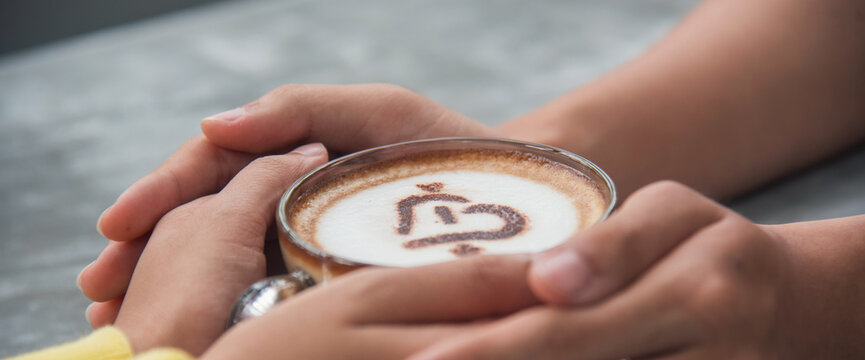 Banner Close up Hands holding coffee cup. Couple lover drinking black cup of coffee together. Banner Top view hands two people happy cafe coffee shop. Espresso shot with copy space