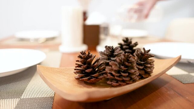 Rustic Pinecone Centerpiece in Wooden Bowl on Elegant Dining Table