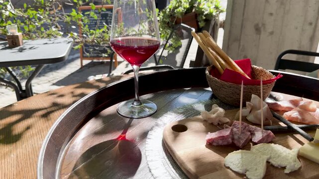 Red Wine and Charcuterie Board at an Outdoor Cafe in Piedmont Italy