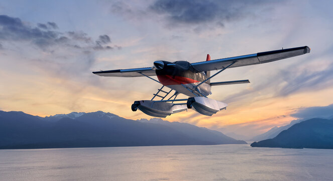 Seaplane Floatplane Flying Over Coastal Mountains At Sunset Near BC, Canada With Dramatic Sky