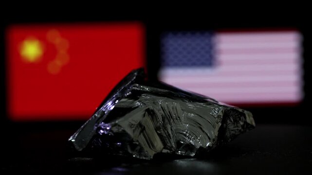 Monocrystalline silicon chunk rotating in front of USA and China flags