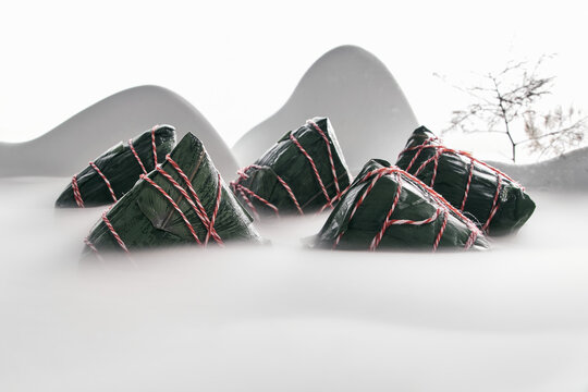 Traditional Chinese Zongzi Rice Dumplings in Misty Mountain Setting