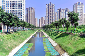 Modern City with Natural Landscape and Urban Garden Canal © PhamHong