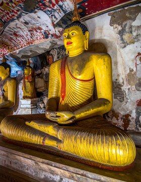 Golden Buddha statue in meditation posture.