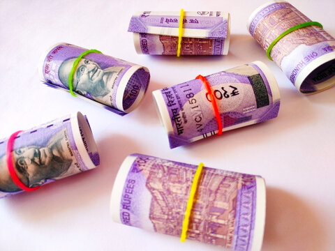 Indian Hundred Rupee Note Rolls for Banking and Financial Concepts