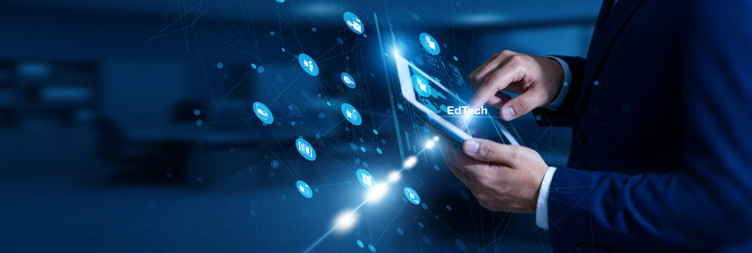 EdTech Specialist touching EdTech using tablet smart network, digital tools, education platforms, innovation, interactive learning.
