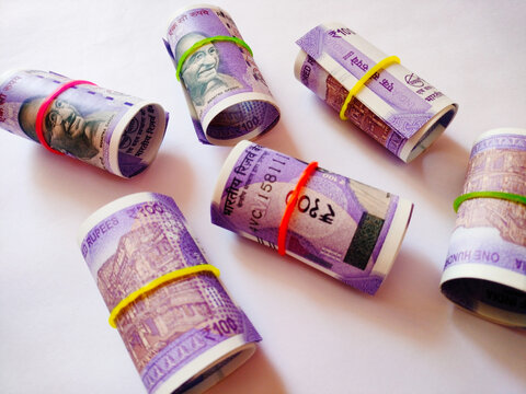 Rolled Indian Currency Notes Isolated on Clean White Backdrop