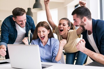 Obraz premium Young professionals cheering at laptop after business achievement