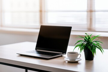 Fototapeta premium Clean laptop workspace with coffee and indoor plant