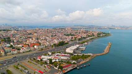 Obraz premium Istanbul, Turkey. Bosphorus embankment. Historical city center. Fatih district. Cloudy weather at sunset, Aerial View