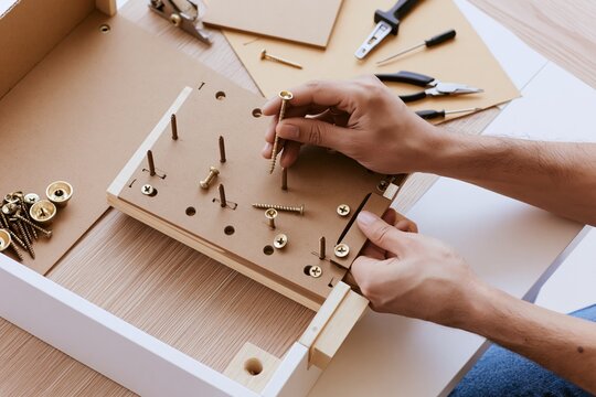 Installing drawer hardware during wooden furniture assembly