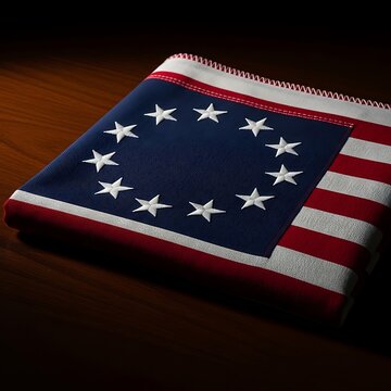 Betsy ross american flag with thirteen stars in a circle on a wooden table. 13 colonies flag