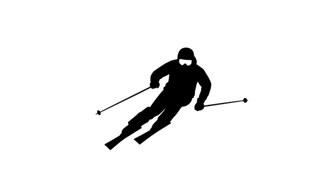 Silhouette of a skier descending a slope, dynamic action pose