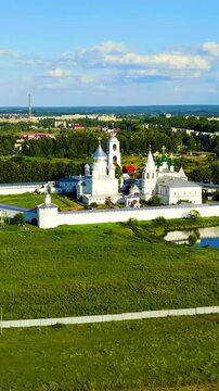 Vertical video. Pereslavl-Zalessky, Russia. Nikitsky Monastery - Monastery of the Pereslavl Diocese of the Russian Orthodox Church. Drone footage, Departure of the camera. Rich colors