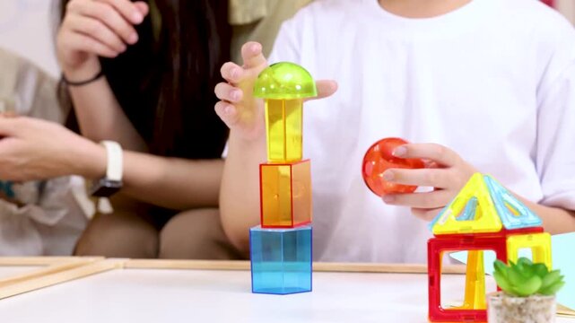 Children Building Colorful Block Tower in Classroom Activity